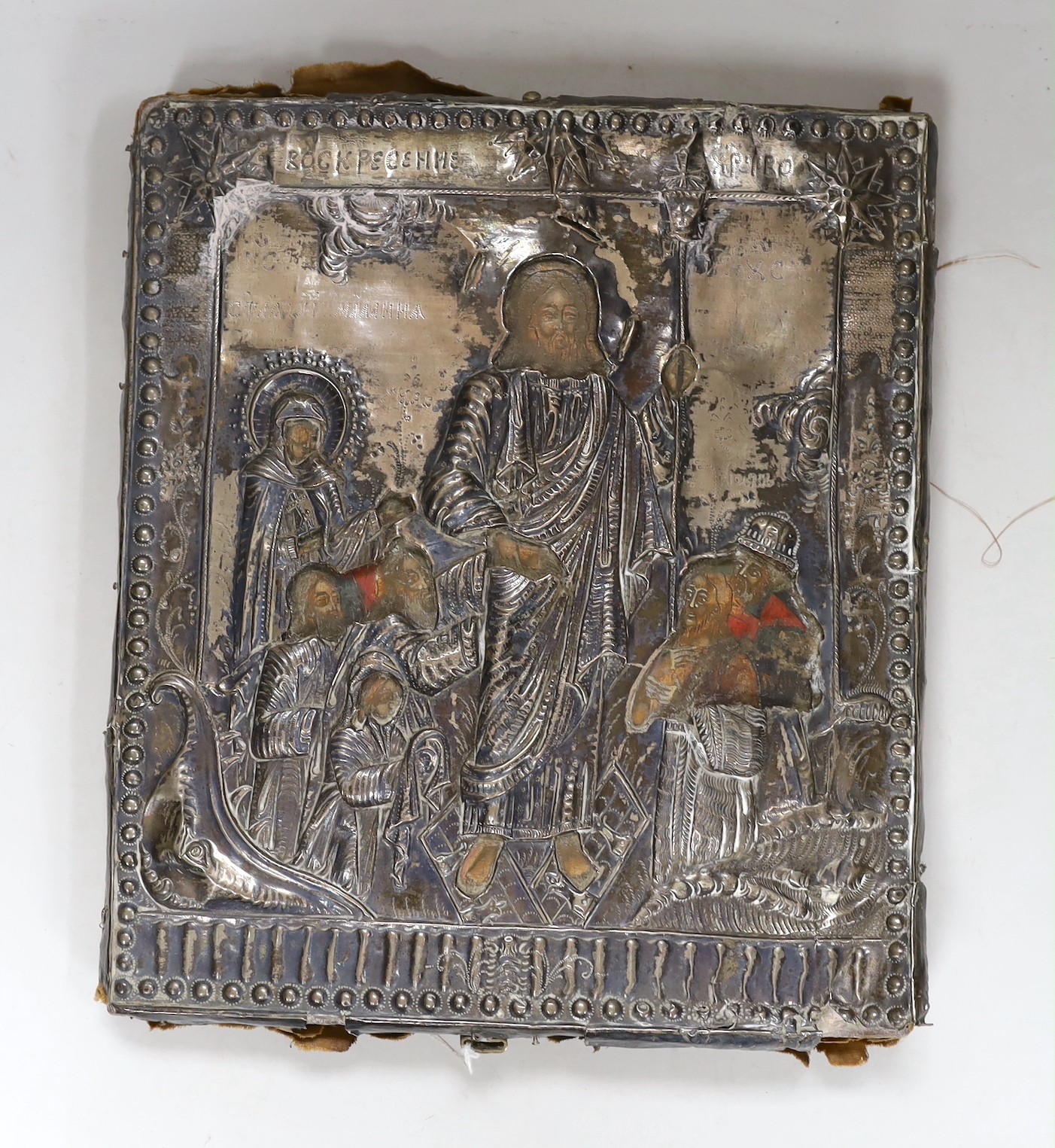 A 19th century Eastern European icon with white metal oklad 30x26cm